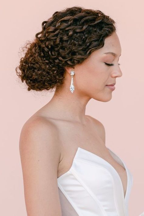 From braided chignons to twisted knots, low buns are the quintessential hairstyle for a classic and modern aesthetic. Here, we've rounded up 10 stunning low bun styles to inspire your own. Curly Bun Bridal Hair, Low Bun Styles, Low Bun Wedding Hairstyles, Low Curly Bun, Bun Wedding Hairstyles, Bun Wedding, Braided Chignon, Low Buns, Side Updo