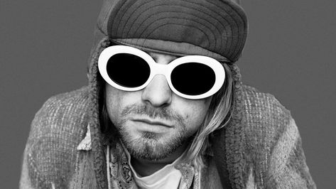 A look at the life and legacy of late Nirvana frontman Kurt Cobain Clout Goggles, Marines Girl, Eyeglasses Men, Nirvana Kurt Cobain, Nirvana Kurt, White Sunglasses, Rock Stars, Men Eyeglasses, Oval Sunglasses