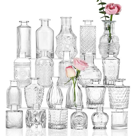 PRICES MAY VARY. 【RETRO STYLE】Small bud vase set of 22, each transparent glass vase surface is decorated with retro exquisite relief patterns, retro elegant and classic, can be used for center table decoration, enhance the interior space style! 【HIGH QUALITY】The glass of these 22 bulk flower vases is thic, sturdy and unbreakable, with smooth and rounded mouths, non-slip bottom, stable center of gravity and not easy to fall. 【VARIOUS SHAPES】22 small glass bud vases, each vase has different design Hiasan Perkahwinan, Vasos Vintage, Vases For Centerpieces, Wedding Table Decorations Centerpieces, Glass Vases Centerpieces, Vases For Flowers, Small Vases, Tafel Decor, Small Glass Vases