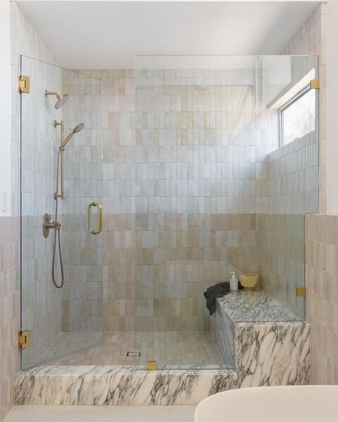 Zia Tile on Instagram: "Pure White or Casablanca? Why not both? Designer @anaberdesign stacked our two iconic zellige neutrals one over the other in this strikingly soft, two-toned shower. 📸 by @charlotteleaphotography" Zellige And Marble Bathroom, Zellige And Marble, Showers With Benches, Zellige Bathroom, Zellige Tile Bathroom, Walk In Shower With Bench, Workers Cottage, Glass Shower Wall, Zia Tile