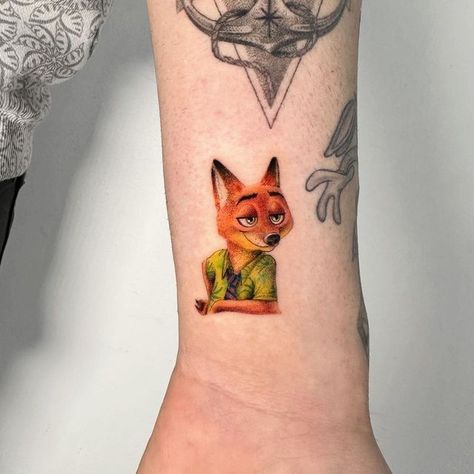 #inkstylemag #tattoos #tattoo #ink #inked #art #tattooed #tattooartist #tattooart #love #instagood #artist #tattoolife #inkedup #like #tattooing #tattooist #girlswithtattoos #instatattoo #follow #inkedgirls #tatt #tattooer #bodyart Zootopia Tattoo, Nick Wilde Zootopia, Tattoo On The Wrist, Fox Tattoo Design, Tato Minimal, Floral Thigh Tattoos, Inner Forearm Tattoo, Nick Wilde, Petite Tattoos