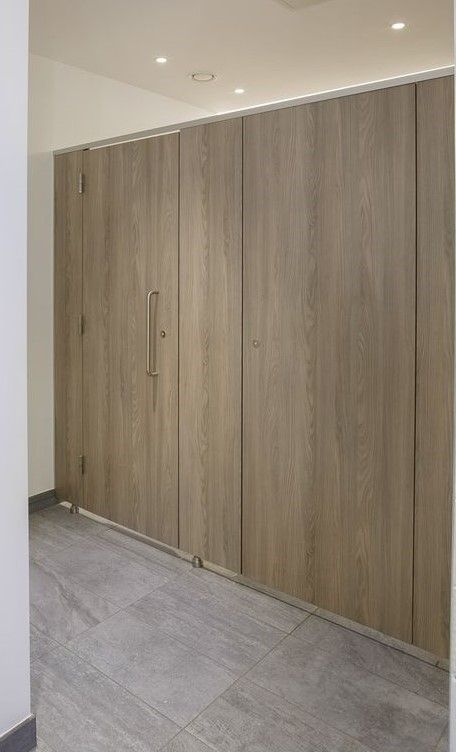 Extended stall height with light wood finish. Public Shower, Bathroom Stalls, Light Wood Finish, Gym Showers, Bathroom Stall, Public Bathrooms, Stall Designs, Homeless Shelter, Retro Interior