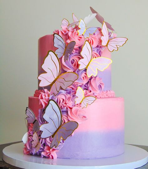 Pink and purple butterfly theme cake Pink And Purple 2 Tier Cake, 2 Tier Birthday Cake Butterfly, Purple And Gold Butterfly Birthday, 2 Tier Butterfly Cake Ideas, Butterfly Cake Ideas 1st Birthday, Pink Purple And White Cake, Encanto Two Tier Cake, Two Tier Cake For Girl, Pastel Butterfly Cake 2 Tier