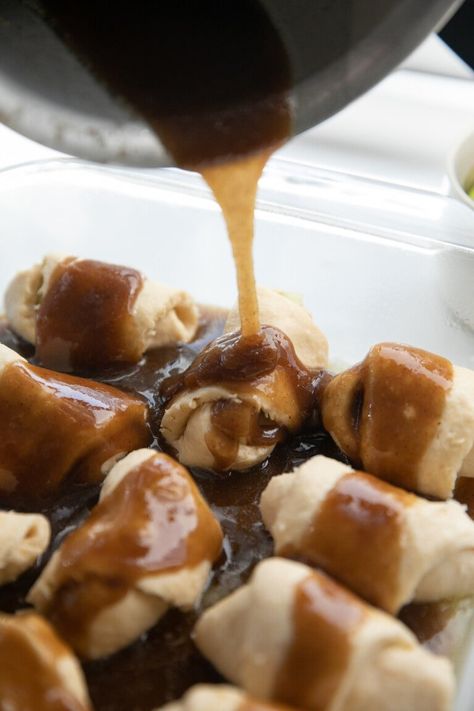 pouring sauce over apple dumplings Apple Dumplings With Crescent Rolls, Caramel Apple Sauce, Cinnamon Crescent Rolls, Best Apples For Baking, Apple Dumpling Recipe, Baked Apple Dessert, Caramel Recipes Sauce, Apple Dumplings, Homemade Caramel Sauce