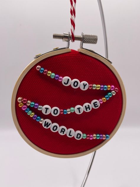 This sweet 3" beaded embroidery hoop art Christmas ornament showcases lyrics from a holiday song and is sure to spread holiday cheer. It's made from beads, upcycled fabric, felt, and an embroidery hoop. Free regular mail delivery (not tracked) is included in the price. Letter Bead Christmas Ornaments, Beaded Felt Ornaments Diy, Bead Embroidery Ornament, Felt Hoop Art, Embroidery Hoop Ornaments Diy, Christmas Beaded Ornaments, Year Embroidery Hoop, Embroidery Ornaments Diy, Lyric Embroidery