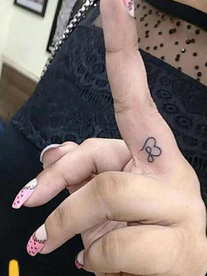 Top 24 Fingers Heart Tattoos To Must Try In 2024 Healed Finger Tattoos, Infinity Finger Tattoos, Finger Tattoos Fade, Infinity Love Tattoo, Love Finger Tattoo, Infinite Tattoo, Heart With Infinity Tattoo, Heart Tattoo On Finger, Infinity Tattoo Designs