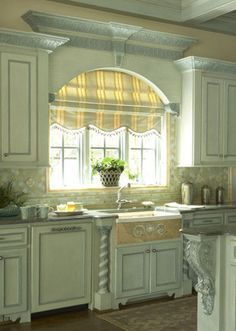 Arched windows over sink with roman shade and molding connecting to cabinets. The cornices and roman shade really complete the look! Kitchen Window Arch, Kitchen Window Treatments Over Sink Diy, Kitchen Window Treatments Over Sink, Kitchen Window Curtains Over Sink, Rounded Kitchen, Kitchen Arch, Arched Window Treatments, Sink Window, Mediterranean Beauty