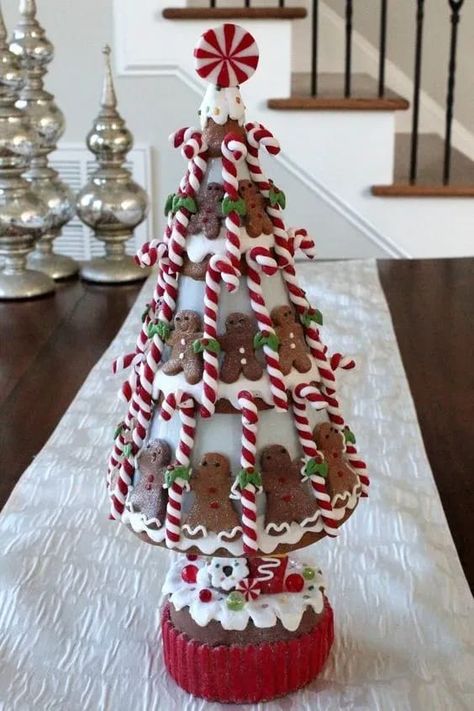 Sweetnes overloaded- gingerbread cookies combined with peppermint candy cones into a lovely Christmas tree. Cookies And Candy, Gingerbread Christmas Tree, Gingerbread Crafts, Gingerbread Christmas Decor, Raz Imports, Peppermint Christmas, Gingerbread Decorations, Christmas Gingerbread House, Gingerbread Christmas