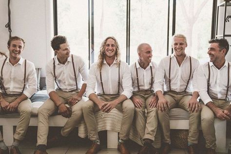 Groom and groomsmen wear beige chinos with white open neck shirts and braces for a beach wedding. Images by Nathan Lapham #groom #groomsmen #groomstyle 2023 Plans, Beach Wedding Groom, Grooms Attire, Wedding Groomsmen Attire, Festival Themed Wedding, Jervis Bay, Dapper Grooms, Coachella Inspiration, Groom Wedding Attire