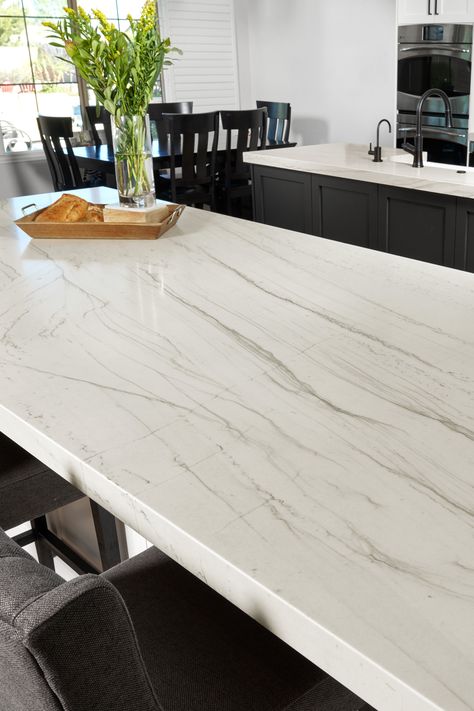 Mont Blanc Satin Quartzite resembles marble in appearance but is much harder and more durable. Because of this, it can be used for kitchen countertops without having the scratching and etching issues experienced with marble. Tap the photo to learn more. #quartzitecountertop #ArizonaTile Montclair White Quartz Countertops, Mont Blanc Countertops, White Quartzite Kitchen Countertops, Mont Blanc Quartzite Countertops, White Macaubas Quartzite Countertops, Mont Fantasy Quartz Countertop, White Quartzite Kitchen, Mont Blanc Quartzite, Quartzite Kitchen Island