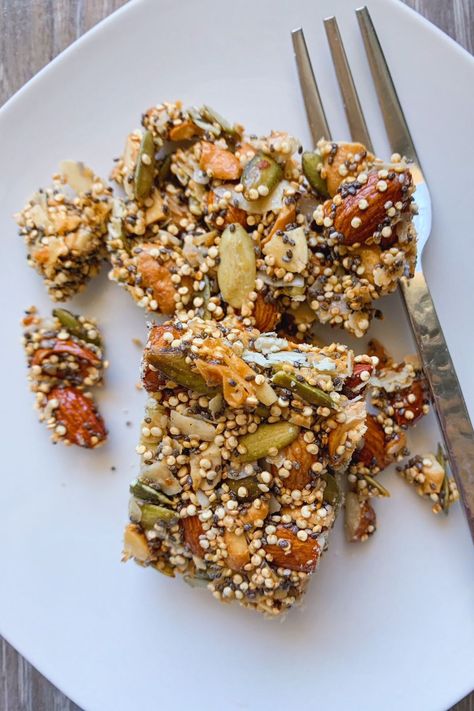 Nut and Seed Bars on a plate with a fork. Vegan Nut And Seed Bars, Seed And Nut Bars, Nut And Seed Bars, Seed Bars Recipe, Nuts And Seeds Recipes, Best Breakfast Bars, Seed Granola, Homemade Bars, Quinoa Bars