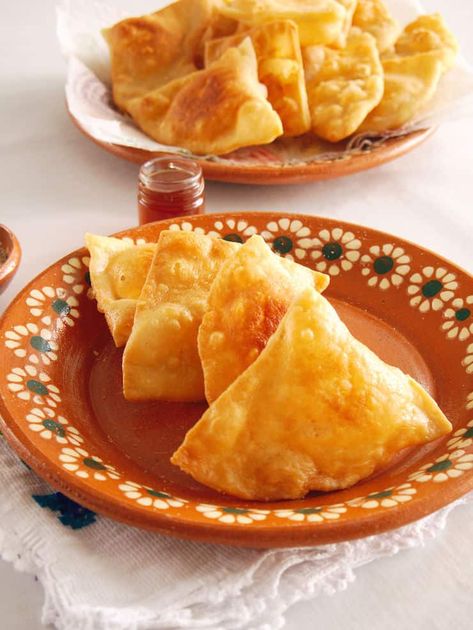 Sopapillas are popular in New Mexican cuisine and are served in almost every New Mexican-style and Tex-Mex restaurant. Serve them as a dessert with a dusting of cinnamon-sugar and a drizzle of honey. #sopaipillas #Mexican #Mexicanrecipe #sopapillas #easy | MuyBuenoCookbook.com @MuyBueno Mexican Beef Soup, Sopapilla Recipe, Hispanic Dishes, Oxtail Soup, Latin American Recipes, Mexican Beef, Fry Bread, Homemade Salsa, New Mexican