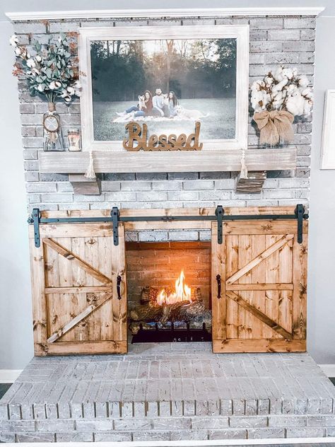 Brick Fireplace Remodel, Farmhouse Fireplace Decor, Lakehouse Ideas, Fireplace Redo, Ranch House Decor, Fireplace Cover, Brick Fireplace Makeover, Fireplace Doors, Barn Door Designs