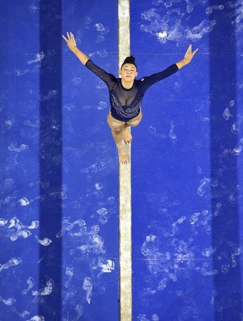 UCLA gymnast Kyla Ross competes on the beam at Pauley Pavilion. Norah Flatley, Ucla Gymnastics, Gymnastics Pics, Gymnastics Aesthetic, Madison Kocian, Ucla College, Gymnastics Wallpaper, Katelyn Ohashi, Sports Background