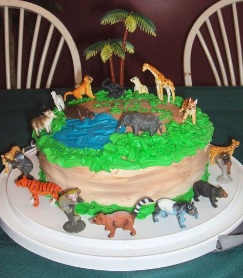 Jungle Birthday Easy cake. Buttercream frosting with plastic jungle animal set. Got to eat the cake and play with the animals too! Zoo Birthday Cake, Cake Buttercream Frosting, Jungle Birthday Cakes, Cars Theme Cake, Car Cake Toppers, Wild Birthday Party, Jungle Cake, 4th Birthday Cakes, Safari Cakes