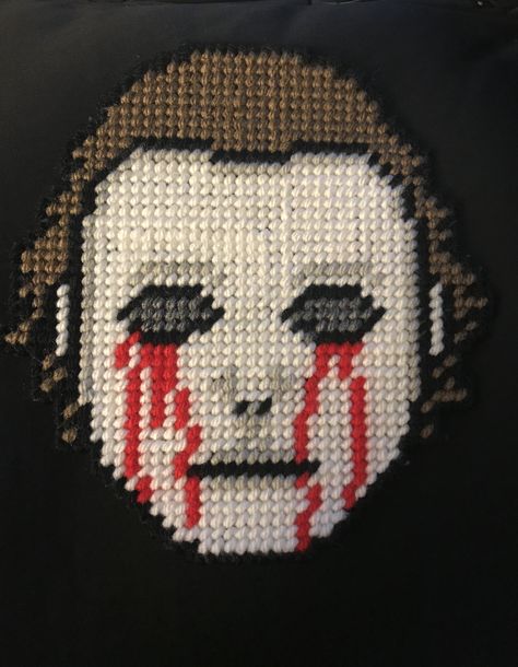 Michael Myers plastic canvas Plastic Canvas Horror Patterns, Horror Ornaments, Horror Crochet, Stitch Halloween, Horror Movie Icons, Plastic Canvas Tissue Boxes, Halloween Cross Stitches, Canvas Wall Hanging, Stitch Art