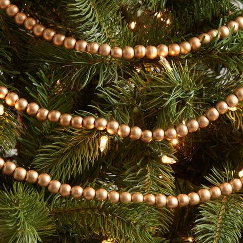 Gold Wood Bead Garland by World Market Bead Garland Christmas Tree, Christmas Tours, Tree Garland, Natural Christmas, Bead Garland, Wood Bead Garland, Christmas 2022, Beaded Garland, Gold Wood