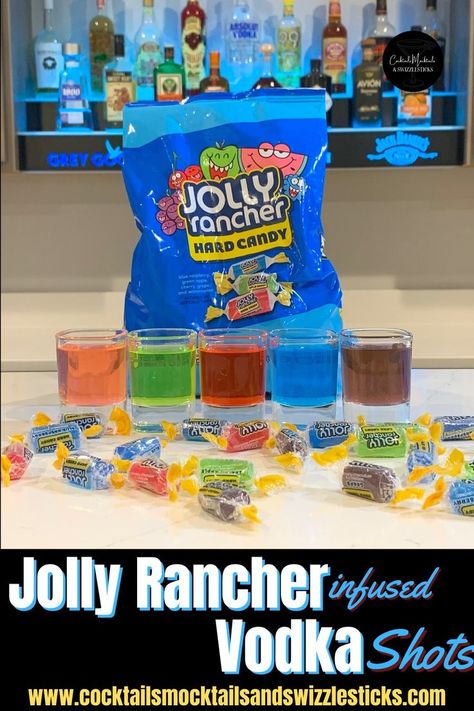 This image shows 5 shots in pink, green, red, blue and purple in front of a bag of jolly rancher candy with jolly rancher candies scattered around. Jolly Rancher Drink, Jolly Rancher Jello, Jolly Rancher Shot, Jolly Rancher Vodka, Layered Shots, Bottle Of Vodka, Candy Shots, Vodka Infused, Jolly Rancher Hard Candy