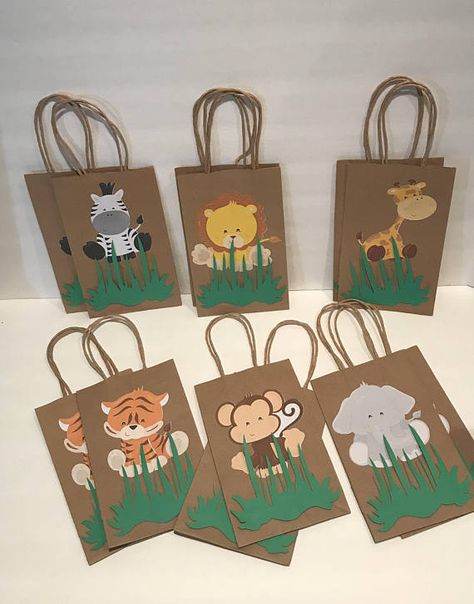 These adorable Safari favor bags are a special addition to your safari themed party They are great for candy table decoration, and they make special thank you party favor. 12 Goodie Bags (2 of each character) Bags are 8”H (without handles) X 5” W Jungle Theme Birthday Party, Zoo Birthday Party, Jungle Thema, Wild Birthday Party, Jungle Theme Birthday, Jungle Birthday Party, Safari Theme Birthday, Zoo Birthday, Jungle Baby Shower Theme