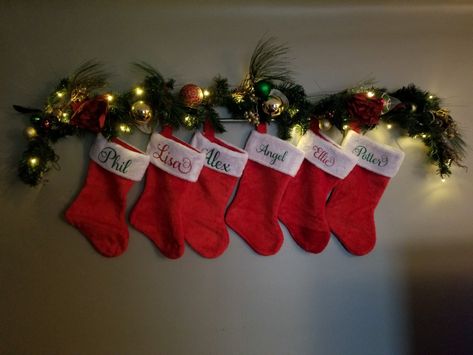 Just wanted to share for anyone needing ideas. I just used 2 command hooks, a round curtain rod and some garland. All done and no new holes in my wall! Christmas Socks Wall, Christmas Stocking On Wall Ideas, Stockings Christmas Hanging, Stocking Wall Ideas, Stocking On Wall Ideas, Stockings On Wall Ideas, Christmas Stocking Hanging Ideas, Stocking Hanging Ideas, Indoor Christmas Decor Ideas