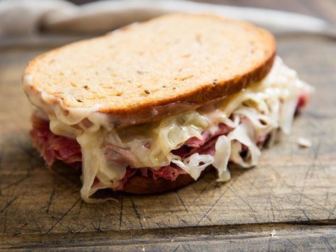 Classic Reuben Sandwich (Corned Beef on Rye With Sauerkraut and Swiss) Recipe | This classic deli sandwich is made by stuffing toasted rye bread with corned beef, sauerkraut, melted Swiss cheese, and Russian dressing. The key to success is to keep everything nice and hot.	  #sandwichrecipes #sandwiches #sandwichheaven #seriouseats #recipes Super Bowl Sandwiches, Deli Sandwiches Recipes, Classic Reuben Sandwich, Reuben Sandwich Classic, Reuben Sandwiches, Swiss Recipes, Reuben Sandwich, Cuban Sandwich, Deli Sandwiches