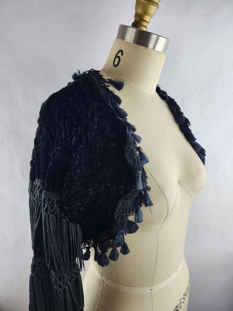 Black Shirring Velvet Stretchy Shrug Brand: Isabel Martin London 56% VI 33% cotton 11% lucrative one size made in UK Vintage condition: This jacket is vintage and shows a little wear. The fringe can be pulled out easily, the left sleeve is missing a lot of fringe on the one side as seen in the 5th image.  Please take a close look at all of the images. Measurements: chest: 31" (78.7 cm) empire waist: 26" (66 cm) length: 12" (30.5 cm) sleeve: 20" (50.8 cm) feel free to contact me with any question Bolero Sweater, Shrugs And Boleros, Tassel Fringe, Second Skin, Empire Waist, Sweater Jacket, Black Velvet, Womens Clothing Tops, Tassels