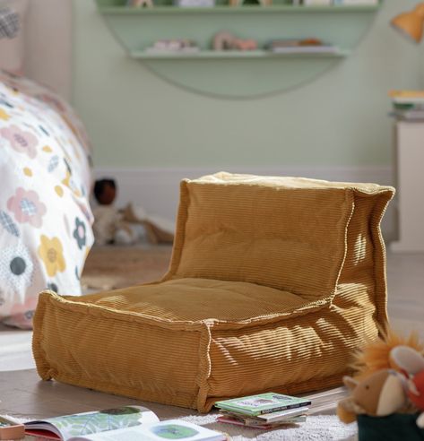 Lounging made easy. Estelle, our mustard mini beanbag is your child&apos;s new best friend. With a big seat and sloped back in soft cord fabric, they&apos;ll be resting comfortably in no time. From gaming to reading, chill in this contemporary chair. Fancy a change of scene? Just pick it up and plop it down. Now that&apos;s the way to relax. Made from polyester. Size H48, W55, D65cm. 5.5kg. Wipe clean. Passes UK FR regulations. Childrens Reading Corner, Toddler Bean Bag, Kids Lounge Chair, Reading Corner Kids, Chill Out Room, Toddler Boy Room Decor, Kids Rooms Inspo, Dream Dining Room, Box Room