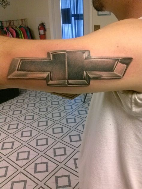 Chevy tattoo! Complete with a chrome look! Chevy Sign Tattoos, Chevy Logo Tattoo, Chevy Symbol Tattoo, Chevy Bowtie Tattoo, Chevy Tattoo, Southern Tattoos, Male Tattoos, Chevy Bowtie, Graffiti Lettering Fonts