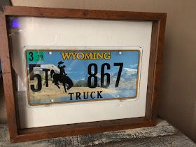 License Plate Display, Diy License Plate, License Plate Wall, Moving To Alaska, Old License Plates, Moving To Colorado, Diy Shadow Box, Cowboy Christmas, Plate Display