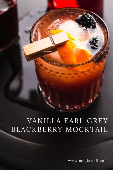 This Vanilla Earl Grey Blackberry Mocktail has delicious currents of vanilla, orange, bergamot, and blackberry and is the perfect mocktail for tea lovers! | Non Alcoholic | Summer Drinks | Shrub Mocktail | #mocktail #megiswell #meganwellsphotography | www.megiswell.com Tea Cocktails Non Alcoholic, Pitcher Of Mock Tails, Tea And Alcohol Drinks, Mood Boosting Mocktail, Mocktails For Tea Party, Earl Grey Mocktails, Tea Mocktails Non Alcoholic, Coffee Mocktail Non Alcoholic, Tea Party Drinks Non Alcoholic