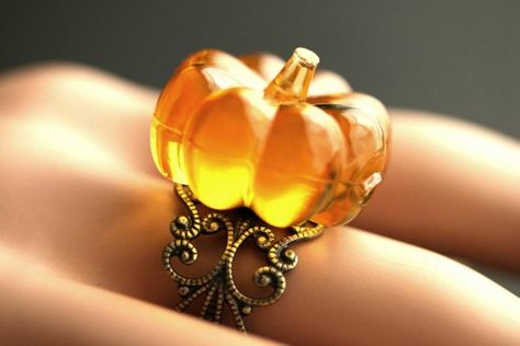 A fun Autumn themed ring designed with a bright orange acrylic pumpkin that has been set upon an adjustable filigree ring base in your choice of finish in this handmade thats adjustable from size 6 and up. Pumpkin Size: 24mm diameter This handmade ring is adjustable from size 6 Pumpkin Ring, Witch Rings, Halloween Ring, Polymer Clay Ring, Feminine Jewelry, Bronze Ring, Evil Eye Ring, Orange Pumpkin, Copper Ring