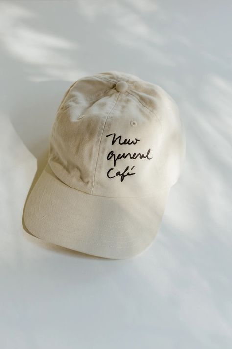 NG Merch Hotel Merchandise, Comfy Cafe, Hotel Merch, Cafe Uniform, Hat Aesthetic, Day Club, Embroidery Caps, Cap Designs, Clothing Photography