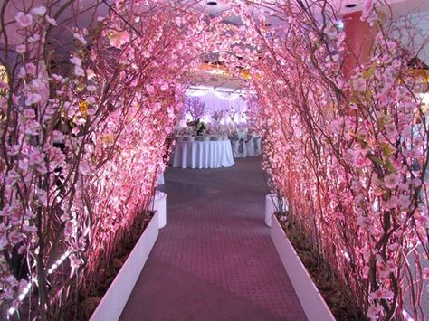 Eco-friendly Event Decor Tips: Use live plants to dress the event venue. It is eco-friendly because you can rent live plants from a local greenhouse and return them after the event. Cherry Blossom Wedding Decor, Branch Arch Wedding, Blossom Wedding Theme, Blossom Tree Wedding, Cherry Blossom Wedding Theme, Cherry Blossom Party, Sakura Wedding, Cherry Blossom Theme, Quince Decorations