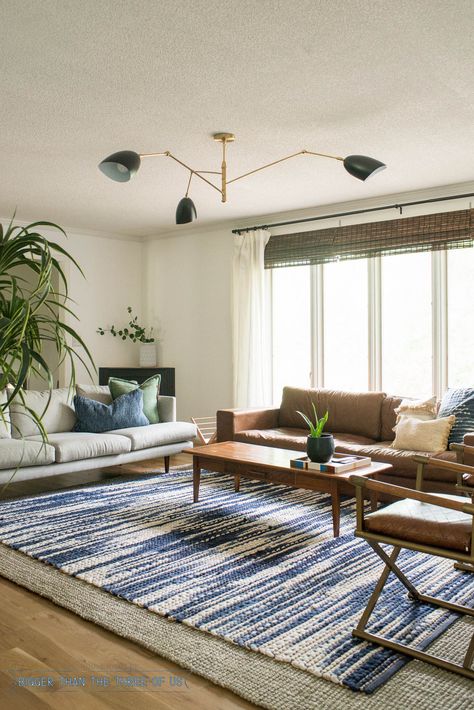 New Black and Brass light for the living room. Blue and white rug, leather couch in living room. Green Living Room Paint, Neutral Living Room Paint, Neutral Living Room Colors, Brass Living Room, Living Room Blue, Blue And White Rug, Dark Living Rooms, Room Blue, Black Living Room