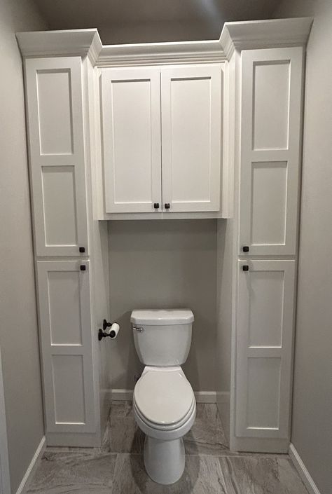 Toilet In Front Of Vanity, Half Bathroom In Basement, Upper Cabinets Bathroom, Built Ins Around Toilet, Bathroom Vanity With Built In Linen Cabinet, Bathroom Toilet Cabinet, Toilet With Storage Above, Corner Cabinets Bathroom, Cabinets Around Toilet