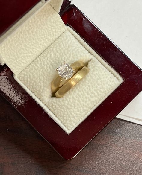 A beautiful set completed for the sweetest couple! One carat Oval diamond, pinched band engagement ring, completed with a brushed finish. Stunning! #HollandsJewelry #finejewelry #wheretraditionsbegin #traditionssince1918 #shoplocal #familyowned Tapered Ring Band, Tapered Engagement Ring With Band, Tapered Band Engagement Ring, Thick Gold Wedding Ring, Thick Band Oval Engagement Ring, Brushed Gold Engagement Ring, Thick Gold Band Engagement Ring, Engagement Rings Classic, Tapered Engagement Ring