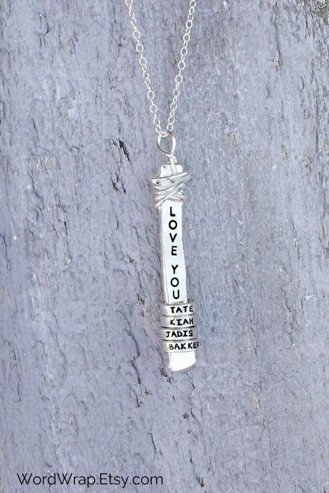 What are you building your family aroundsterling silver mom necklace is personalized with kids  names with your core word at the center. It makes a beautiful gift for mothers and grandmas. Get yours today! #WordWrap #WordWrapJewelry #HandmadeJewelry #GiftsForHer #Necklace #HandStamped #MothersDayGifts #PersonalizedJewelry #GiftForMom #HandmadeNecklace #NameNecklace #PersonalizedNecklace #GiftForWife #HandStampedJewelry #MomNecklace #NameJewelry #RusticJewelry #UniqueJewelry Grandma Necklace Personalized, Hand Stamped Ring, Silver Wrap Ring, Jewelry Quotes, Idaho Falls, Kids Names, Rustic Jewelry, Mothers Necklace, Mom Jewelry