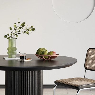 The Japandi Round Small Dining Table is perfect for intimate spaces. It features a sleek black wood top and comfortably seats 2. Ideal for compact dining areas, small apartments or cozy kitchen corners. Add a few leaves and a tropical vibe to your space with this velvet-draped dining chair. This modern armchair is designed ergonomically and makes sitting in it feel luxuriously comfortable. | Latitude Run® Japandi 32" Round Small Dining Table for 2 Person Wood Tabletop brown / greenWood in Black | 29.5" H X 31.5" W X 31.5" L | Wayfair Round Dining Table Small Space, Round Small Dining Table, Small Apartment Dining Area, Small Black Table, Black Kitchen Chairs, Round Dining Table Small, Apartment Dining Area, Dining Table For 2, Kitchen Corners