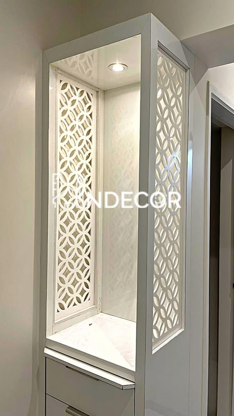 Visit us @ https://www.indecor.co #poojaroom #poojaroomdecor #temple #poojaroominterior #poojaarea #hometemple #homemandir #indianpoojaroom #homerenovation #interiordesign #indecor #interiordesignerinmumbai #residentialinteriors #mumbaiinteriordesigner #commercialinteriors #officeinterior #kandivali #indianinterior #moderninterior Pooja Room Small Space, Tall Mandir Unit Design, Mandir Partion Design, Ashwini Dongre Interior Design, Simple Mandir Design For Home, Simple Mandir Design, Mandir In Home, Mandir Jali Design, Latest Pooja Room Designs