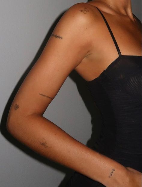 Arm Full Of Tattoos, Discreet Arm Tattoos For Women, Horizontal Shoulder Tattoo, Places To Put Word Tattoos, Very Minimal Tattoo, Tattoo Inspo Quotes, Minimal Tattoo Quotes, Dainty Upper Arm Tattoo, Patch Work On Back Tattoos