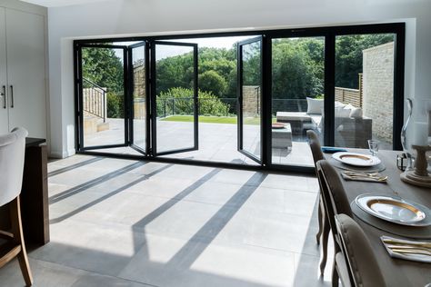 Stunning Aluminium Bi Folding Doors from Bi Folding Door Prices, Design, Price and order instantly online. Available with 12 months 0% finance, either professionally fitted or for DIY. Choose from 2-7 Panel designs in a range of stock colours, bespoke RAL colours are also available. We are the bi fold door experts and we are here to help. #bifold #bifoldoor #bifoldingdoors #aluminiumbifolds #concertinadoors Bifold Doors Onto Patio, Prices Design, Aluminium Bifold Doors, External Bifold Doors, Bifolding Doors, Aluminium French Doors, Folding Patio Doors, Aluminum Doors, Fold Door