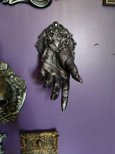 Welcoming our new, truly divine witch hand. This piece comes as standard with a sawtooth backing as this design is required to attach to a wall by a nail. This hand could also be an ornament, if you would like to showcase it, please let us know and we will not add a wall backing!  Heavier than most other wall pieces we offer.  Finish pictured is silver paint. Available in silver / black / gold paint.  Made to order please allow  up to 8 weeks for processing time before shipping. 460g 23cm Hand Wall Art, Goth Houses, Witch Hands, Horn Headband, Dark Home Decor, Goth Home, Goth Home Decor, Dark Home, Witch Decor