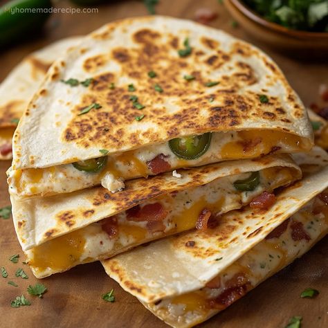 These Jalapeño Popper Quesadillas combine the flavors of jalapeño poppers with a cheesy quesadilla for the ultimate appetizer. They’re easy to make and great for sharing, featuring a crispy tortilla, melty cheese, and a spicy kick from the jalapeños. Kfc Potato Wedges, Cheesy Quesadilla, Snacks And Appetizers, Sweet Potato Cheesecake, Meal Plan Keto, Jalapeño Poppers, Free Keto Meal Plan, Caramelized Bananas, Low Carb Tortillas