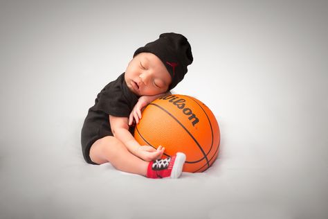 Newborn basketball Basketball Milestone Pictures, Basketball Newborn Photoshoot, Newborn Photography Basketball, Basketball Newborn Pictures, Basketball Maternity Shoot, Basketball Maternity Pictures, Infant Boy Photoshoot Ideas, Basketball Baby Announcement, Basketball Baby Pictures