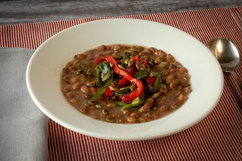 After some noodling around in the kitchen, we came up with this dish featuring our fabulous Buckeye Beans (aka Yellow Indian Woman). Is it a stew? It's not a soup. It's just an incredible bowl of beans packed with flavor. The secret is to cook the beans simply and then top them with the pepper mixture. I'd call it a so Plant Based Soups, Dried Corn, Best Beans, Main Dish Salads, Indian Woman, Kinds Of Salad, Best Side Dishes, Toasted Walnuts, Roasted Peppers