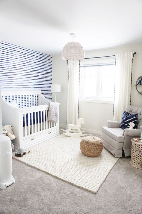 In designing Everton’s nursery, I knew I wanted to create a room that could grow with him as he grew up. I didn’t start off wanting a blue coloured wall, in fact I started off with quit… Nursery Layouts, Lil Cherry, Boy Nurseries, Nursery Ideas Boy, Boys Room Blue, White Rocking Chairs, Grey Nursery Boy, Coastal Nursery, Nursery Tour