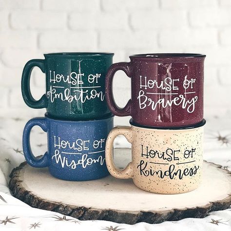 House Campfire Mugs! Perfect for your tea or coffee. Custom, hand-lettered and for sale in my Etsy shop. Along with other cute mugs and home decor. #giftideas #mug #coffeemug #cozy #love #coffee #handlettering #uniquegifts #campfiremug #harrypotter #hufflepuff #gryffindor #slytherin #ravenclaw #hogwarts #books #magical #hogwartshouses Hogwarts Books, Campfire Mugs, Cozy Love, Slytherin Ravenclaw, Gryffindor Slytherin, Harry Potter Pin, Harry Potter Decor, Hogwarts Aesthetic, Harry Potter Room