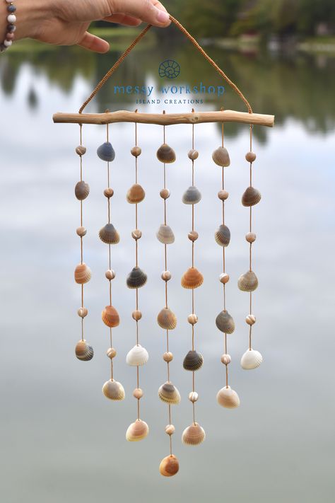 An eclectic gift which will bring good vibes to your living space! Handmade by @messyworkshop and available now on Etsy #messyworkshop #islandcreations #handmade #seashellwindchime #southpadreisland #SPI #texas #motherofpearl #beads #beachdecor #beachvibes Seashell Decorations Diy, River Rocks Crafts, Seashell Wind Chime, Seashell Art Diy, South Padre Island Texas, Padre Island Texas, Seashell Wind Chimes, Sea Shells Diy, Deco Marine