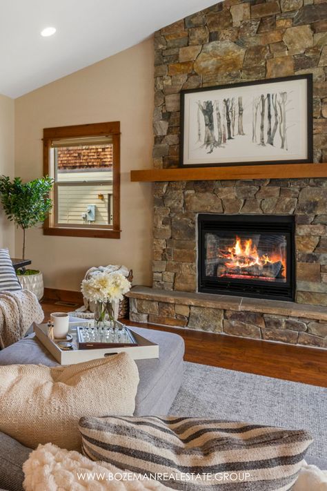 The rock fireplace with modern furniture creates a perfect blend of rustic elegance River Rock Fireplace Ideas, Living Room With Rock Fireplace, Rock Wall Fireplace, Stone Fireplace Wall, River Rock Fireplaces, Rock Fireplace, Shiplap Fireplace, Rock Fireplaces, Bozeman Mt