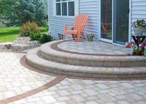 Semi-circle patio steps with soilder course paving blocks | Landscape Solutions by Michael Kirsch, LLC | Oshkosh, WI Half Circle Patio, Circular Porch Steps, Round Front Steps Entrance, Steps From Slider To Patio, Semi Circle Front Door Steps, Rounded Steps Patio, Circle Patio, Paver Steps, New Patio Ideas